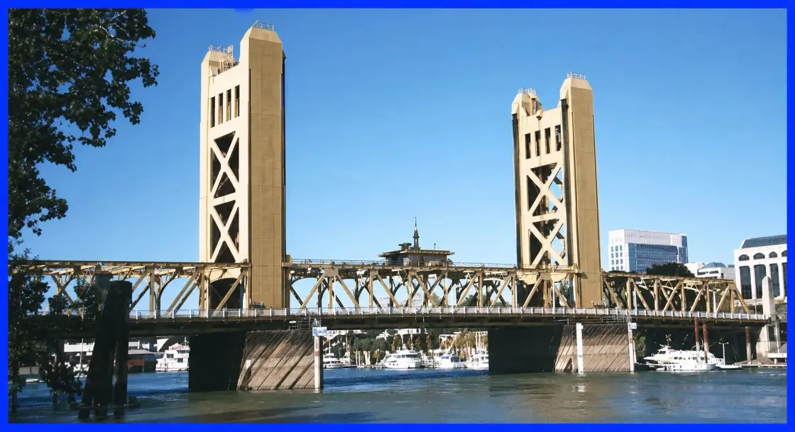 The Sacramento Tower Bridge seen from the river, with its two lift towers and the span lowered