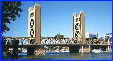 The Sacramento Tower Bridge seen from the river, with its two lift towers and the span lowered